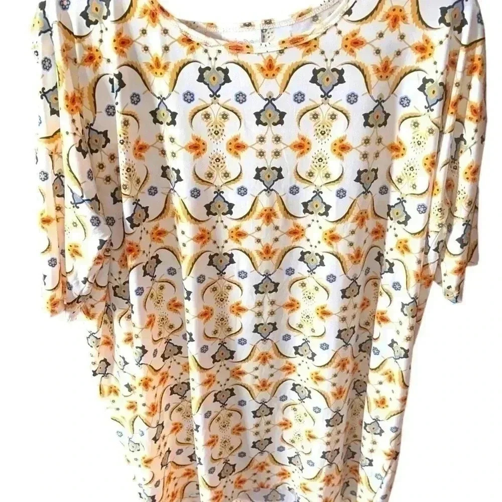Lularoe off white floral Small Irma tunic top‎ . NWT. Gold &blue floral